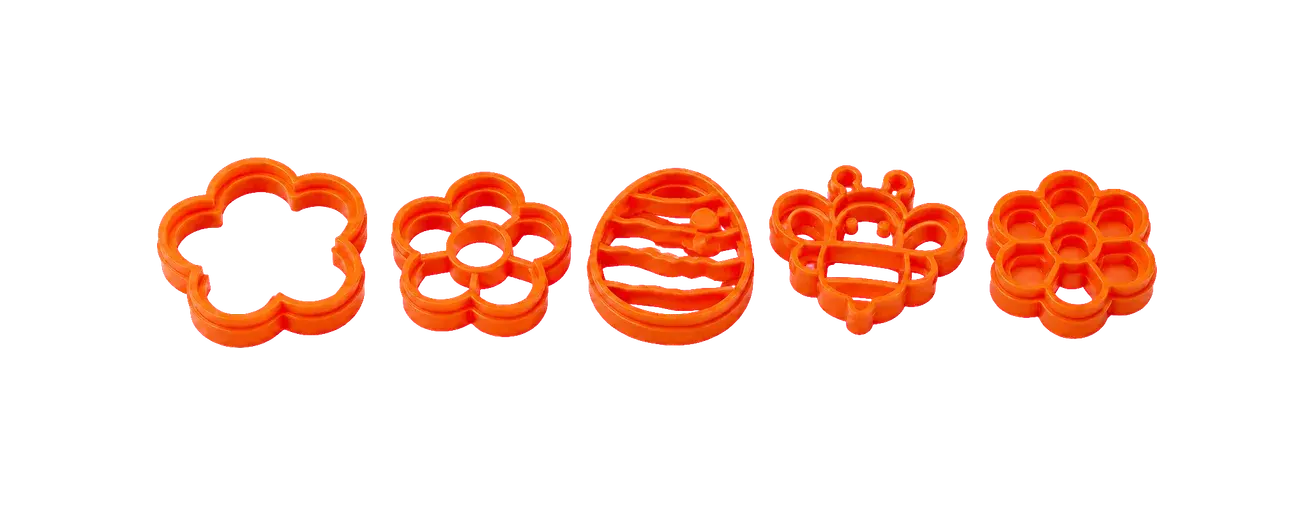 Five orange shape cutters.